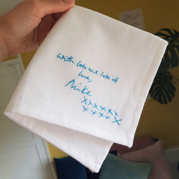 personalised handkerchiefs, made from white organic cotton, hand embroidered with custom handwritten messages