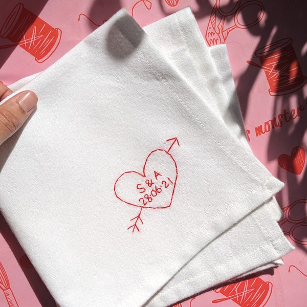 personalised handkerchief gift, made from white organic cotton, hand embroidered with custom heart, initials of couple and wedding or anniversary date