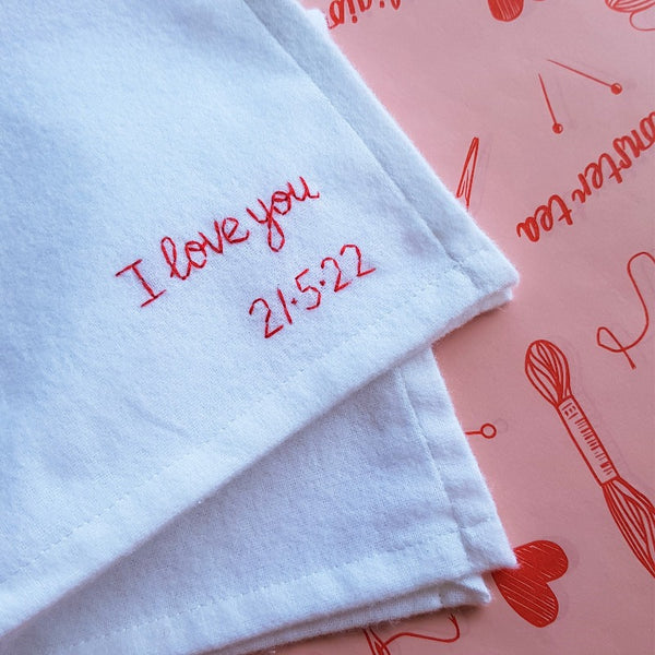 personalised handkerchief gift, made from white organic cotton, hand embroidered with custom message - I love you and date of second wedding anniversary