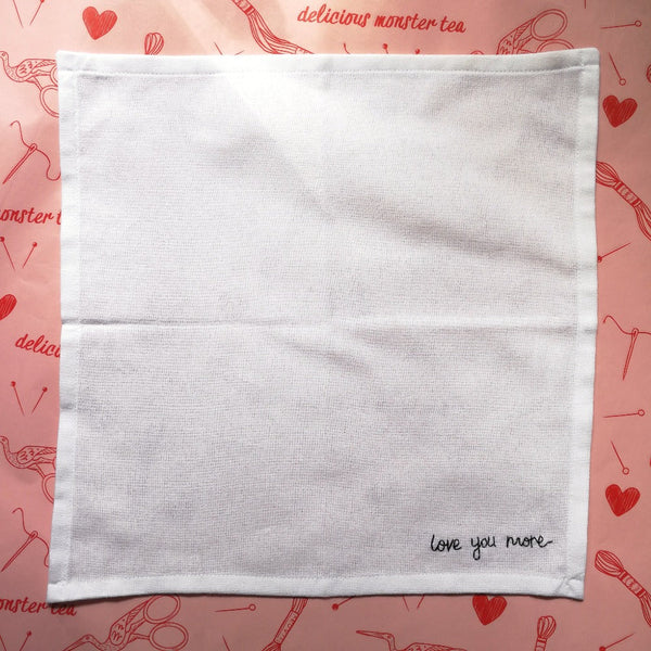 personalised handkerchief gift, made from white organic cotton, hand embroidered with custom message - love you more - as second wedding anniversary gift for husband