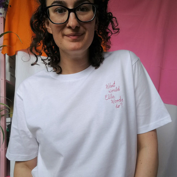organic cotton white slogan tshirt, embroidered with what would elle woods do in pink thread. funny gift for law student graduation or legally blonde fan