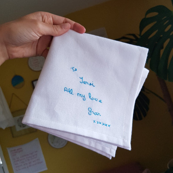 personalised handkerchiefs, made from white organic cotton, hand embroidered with custom handwritten messages