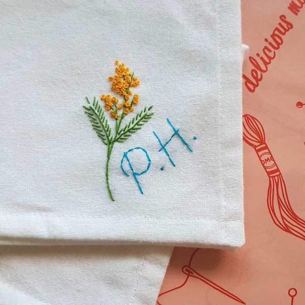 personalised handkerchief, made from white organic cotton, hand embroidered with flower and initials or monogram, as birthday gift for sister