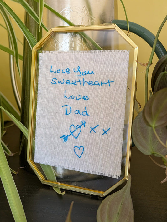 hand embroidered handwritten message from late father on cotton, styled in a gold frame for a memorial keepsake gift