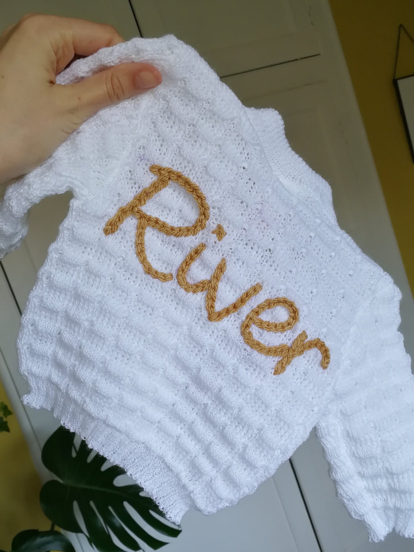 Personalised baby cardigan with hand embroidered name in beige thread