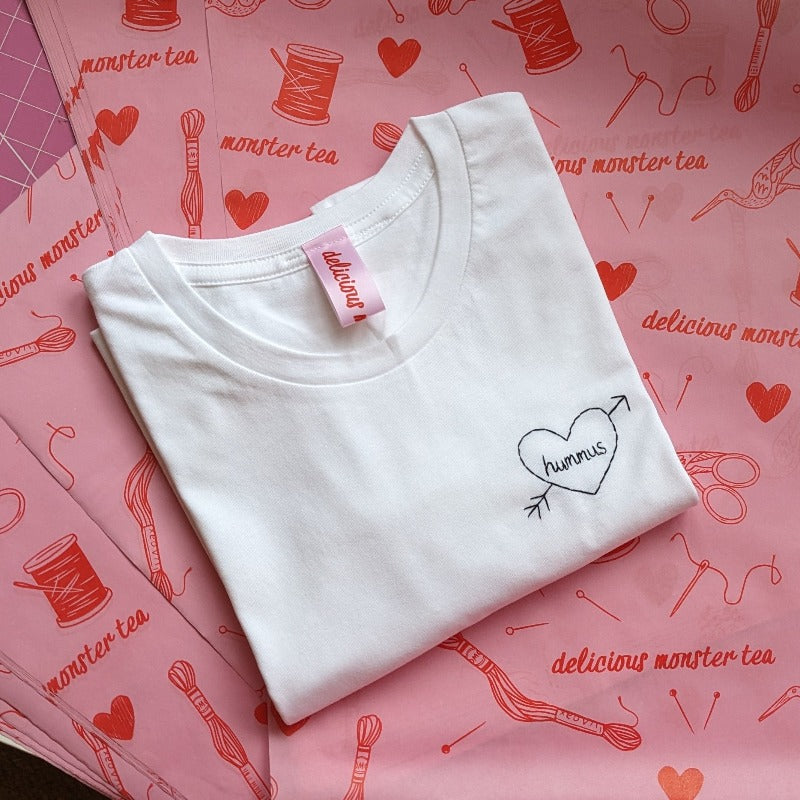 hand embroidered t-shirt, made from white organic cotton, and hand embroidered with a personalised love heart 'hummus', as a funny gift for vegan
