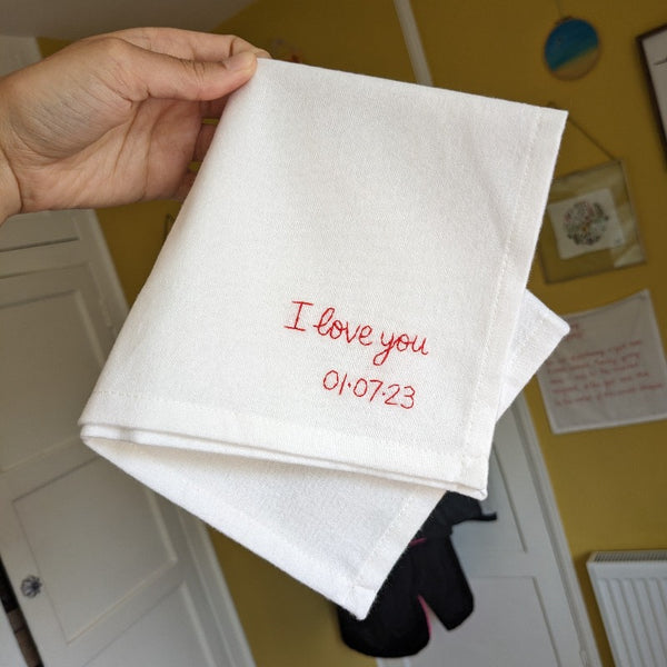 personalised handkerchief gift for groom, made from white organic cotton, hand embroidered with custom message - I love you, with wedding date