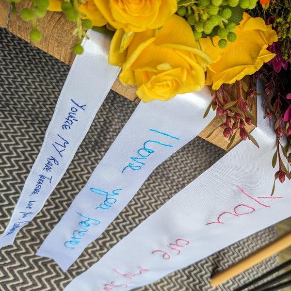 wedding ribbon for bridal bouquet, hand embroidered with a handwritten message