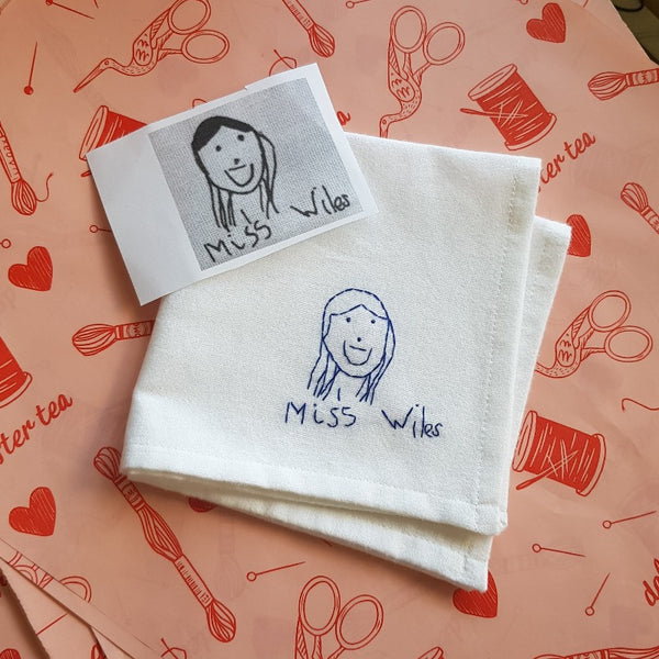 personalised handkerchief, made from white organic cotton, hand embroidered with kids drawing of teacher, as end of term thank you gift for teacher