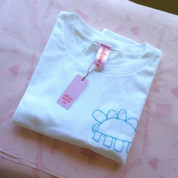 personalised t-shirt, made from white organic cotton, hand embroidered with kids drawing, as gift for mummy or daddy