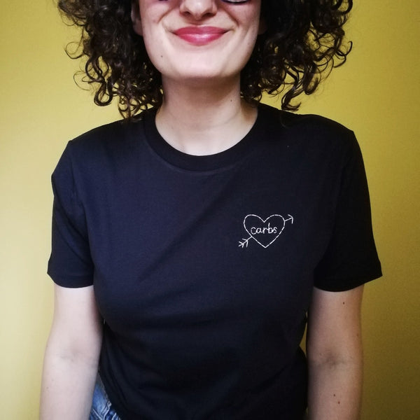 hand embroidered t-shirt, made from navy organic cotton, and hand embroidered with a personalised love heart 'carbs', as a funny gift for vegan