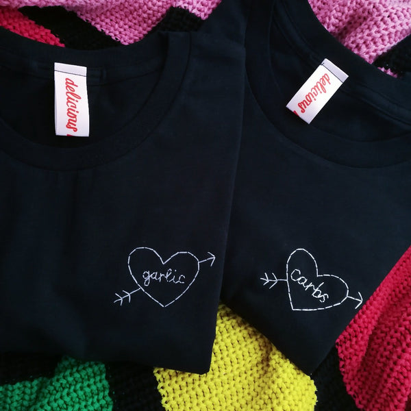 hand embroidered t-shirt, made from navy organic cotton, and hand embroidered with a personalised love heart 'garlic', as a funny gift for vegan
