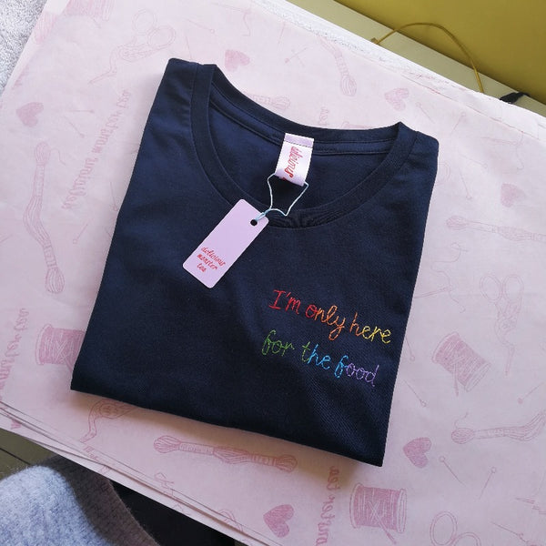 unisex personalised t-shirt, hand embroidered with custom slogan 'I'm only here for the food' in rainbow thread, as funny christmas gift or birthday gift for foodie