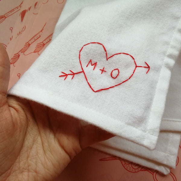 personalised handkerchief gift, made from white organic cotton, hand embroidered with custom heart, initials of couple and wedding or anniversary date
