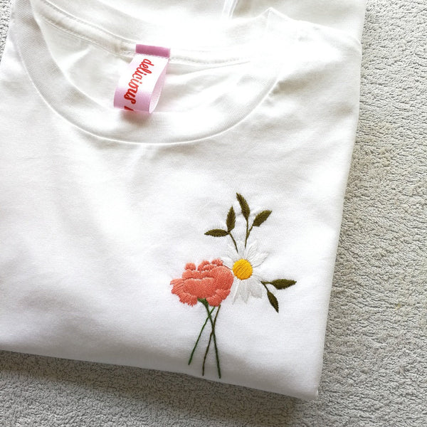 birth flower or wedding bouquet gift. organic cotton tshirt, hand embroidered with posy of custom flowers, including rose, daisy and olive branch