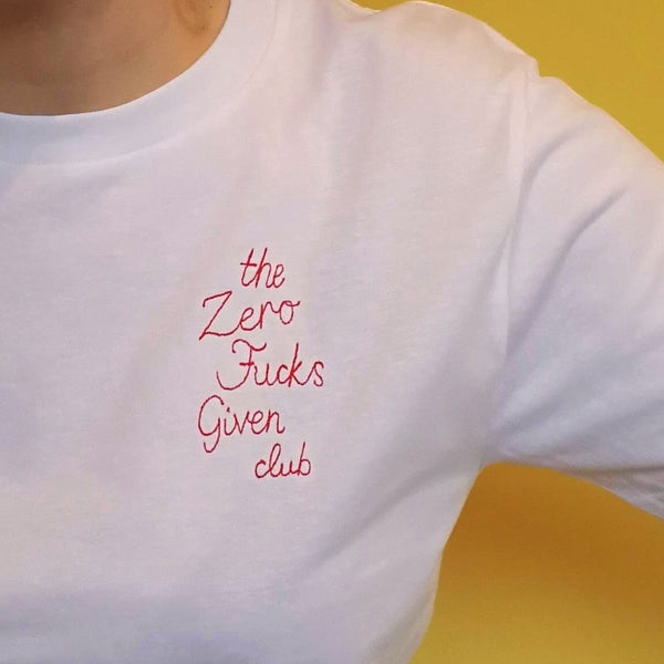organic cotton white slogan t-shirt, embroidered with 'the zero fucks given club' in red thread. funny gift for new mum