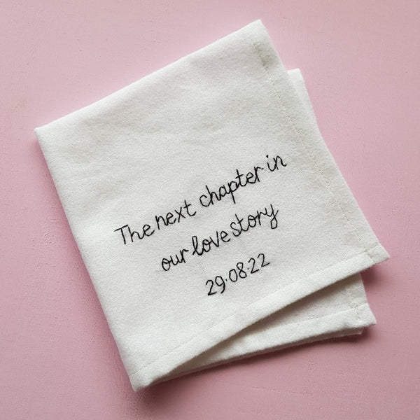 personalised handkerchief gift for groom, made from white organic cotton, hand embroidered with custom message - the next chapter in our love story, with wedding date